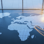 Business person completing world map mosaic.